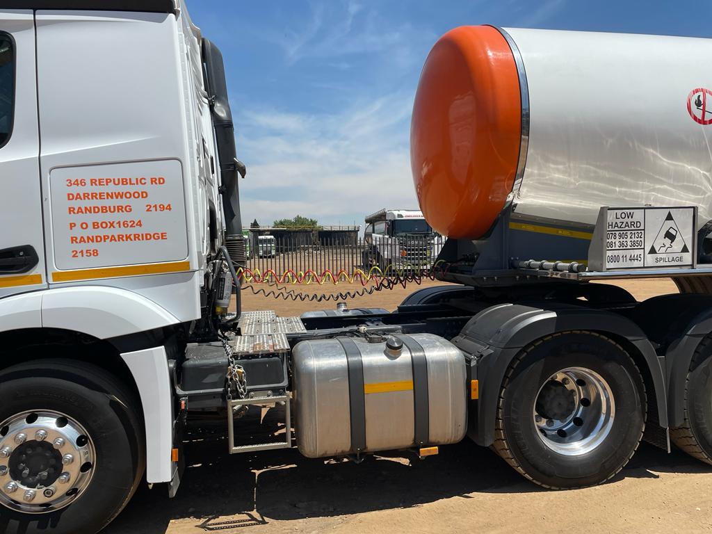 Fleet of trucks carrying freight - NickJak Logistics